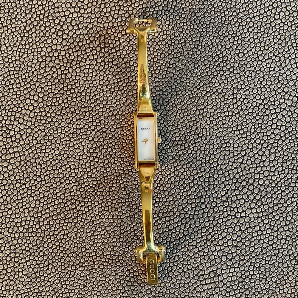 Gucci 1500L Wrist watch bracelet bangle gold plated with mother of pearl face.